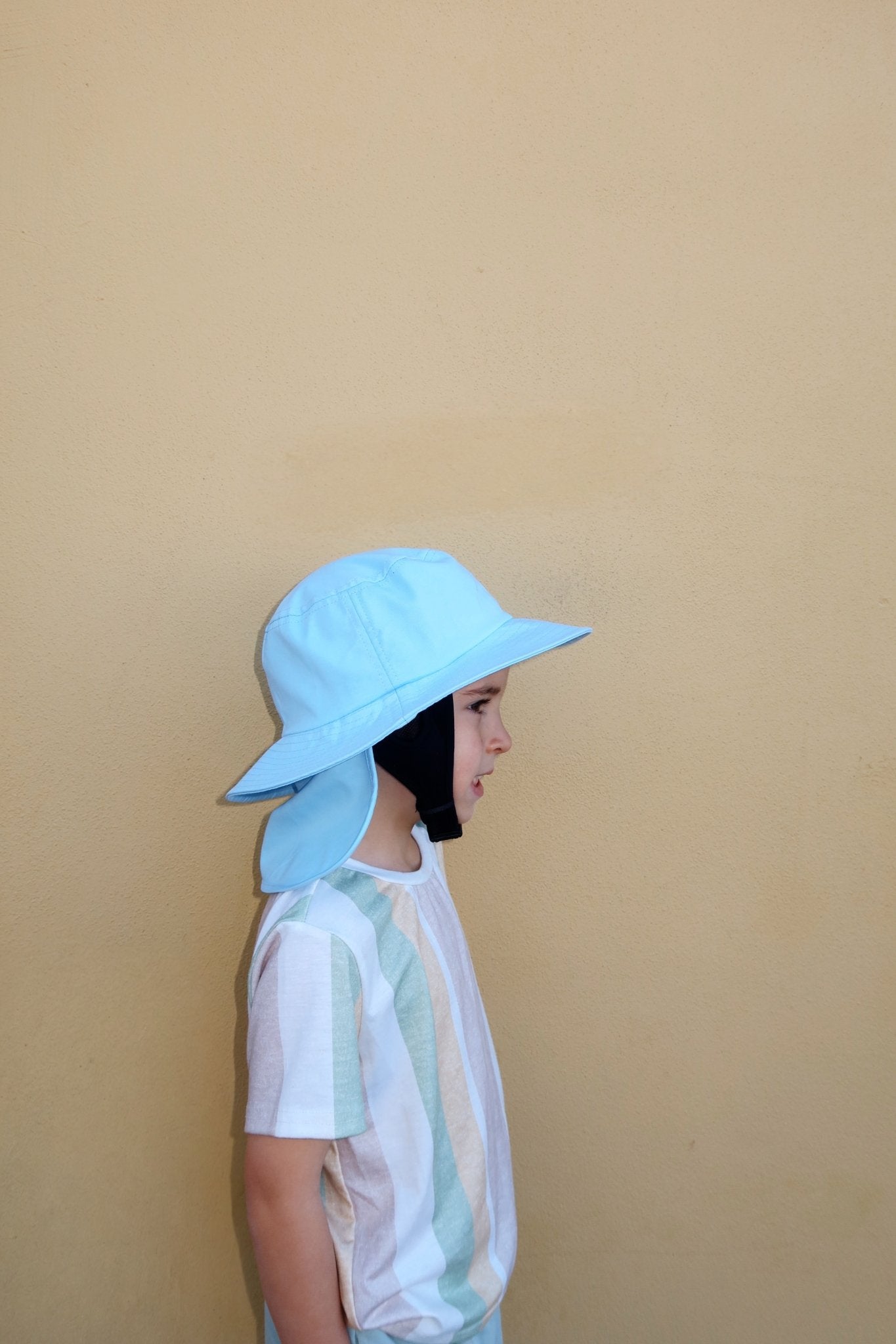 Blue new born hat from Luma: Close-up of a child from side view